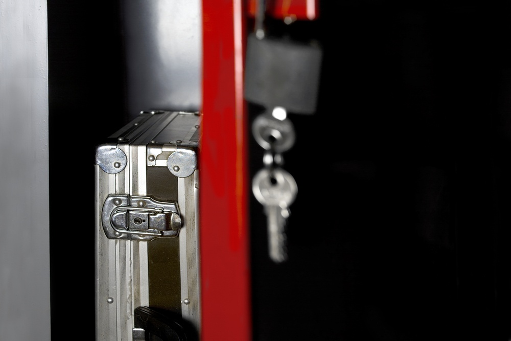 Padlock and keys hanging near a case, representing inadequate access control at a Newark property