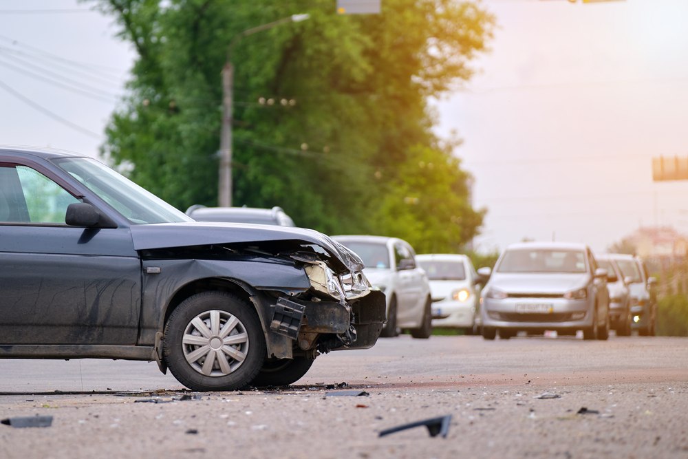 Wrecked car at a New Jersey accident scene where injury symptoms may appear days later